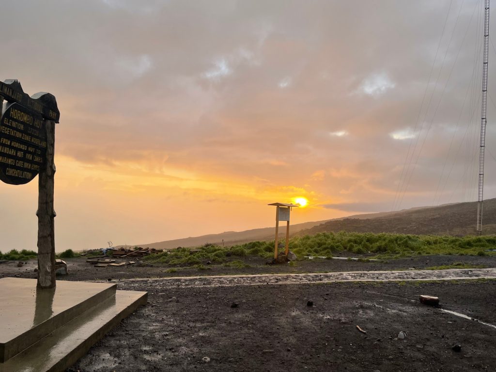 Horombo hut signboard at sunset on Mount Kilimanjaro
